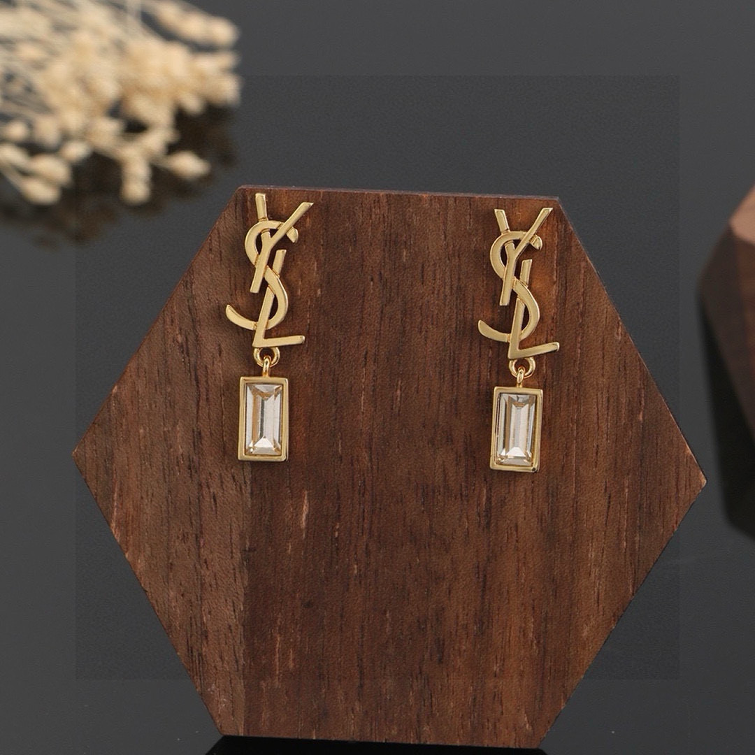 Saint Laurent Cassandre YSL Monogram Crystal Drop earrings Gold-tone metal with clear baguette-cut crystals Silver-tone metal with clear baguette-cut crystals 2 2cm drop length