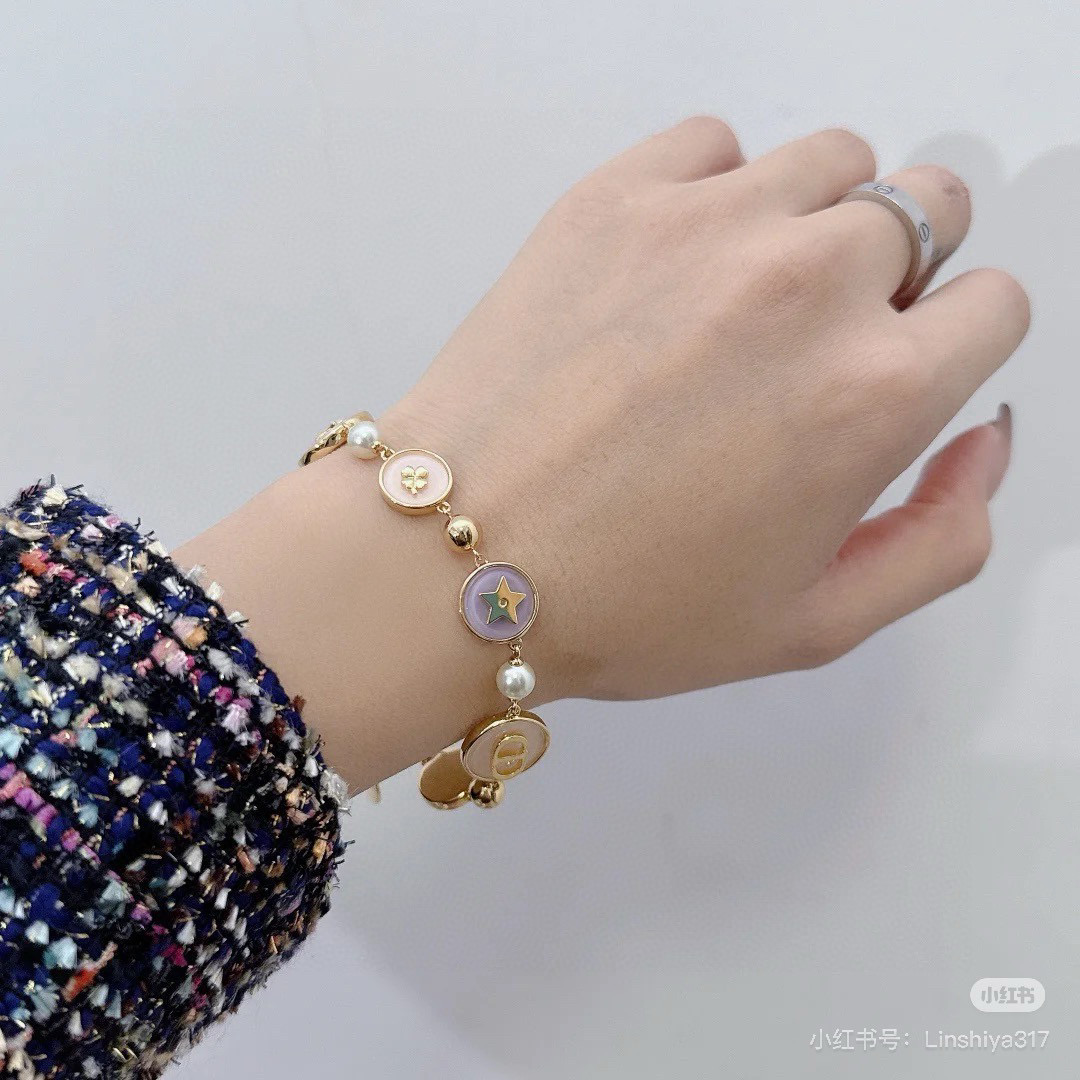 Dior Lucky Charms Enamel Medallion Bracelet bracelet Gold-tone metal with white faux pearls pastel pink light blue lavender enamel and gold-toned charm details 18cm with 3cm extension chain