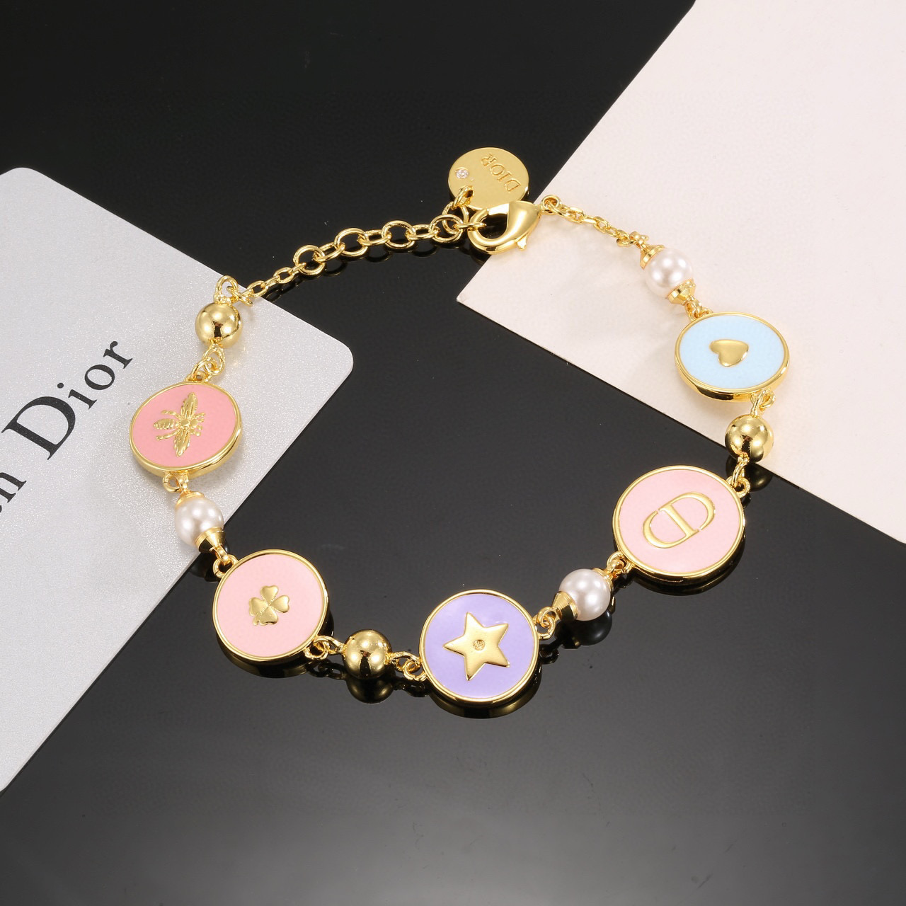 Dior Lucky Charms Enamel Medallion Bracelet bracelet Gold-tone metal with white faux pearls pastel pink light blue lavender enamel and gold-toned charm details 18cm with 3cm extension chain