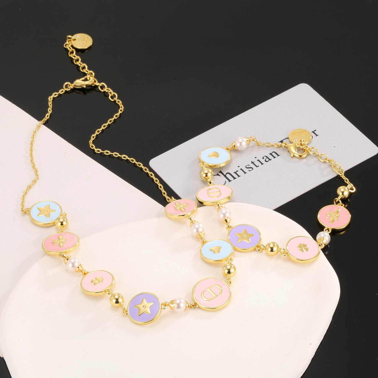 Dior Lucky Charms Enamel Medallion Bracelet bracelet Gold-tone metal with white faux pearls pastel pink light blue lavender enamel and gold-toned charm details 18cm with 3cm extension chain