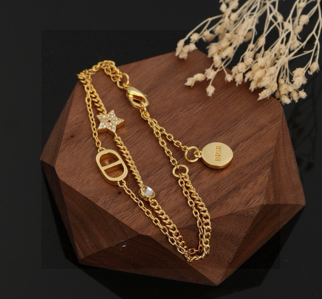 Dior Petit CD Star Double Chain bracelet gold-tone metal with clear crystal accents 16cm with 3cm extender