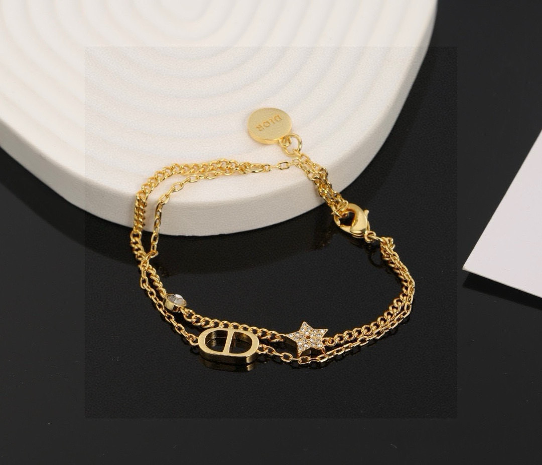 Dior Petit CD Star Double Chain bracelet gold-tone metal with clear crystal accents 16cm with 3cm extender