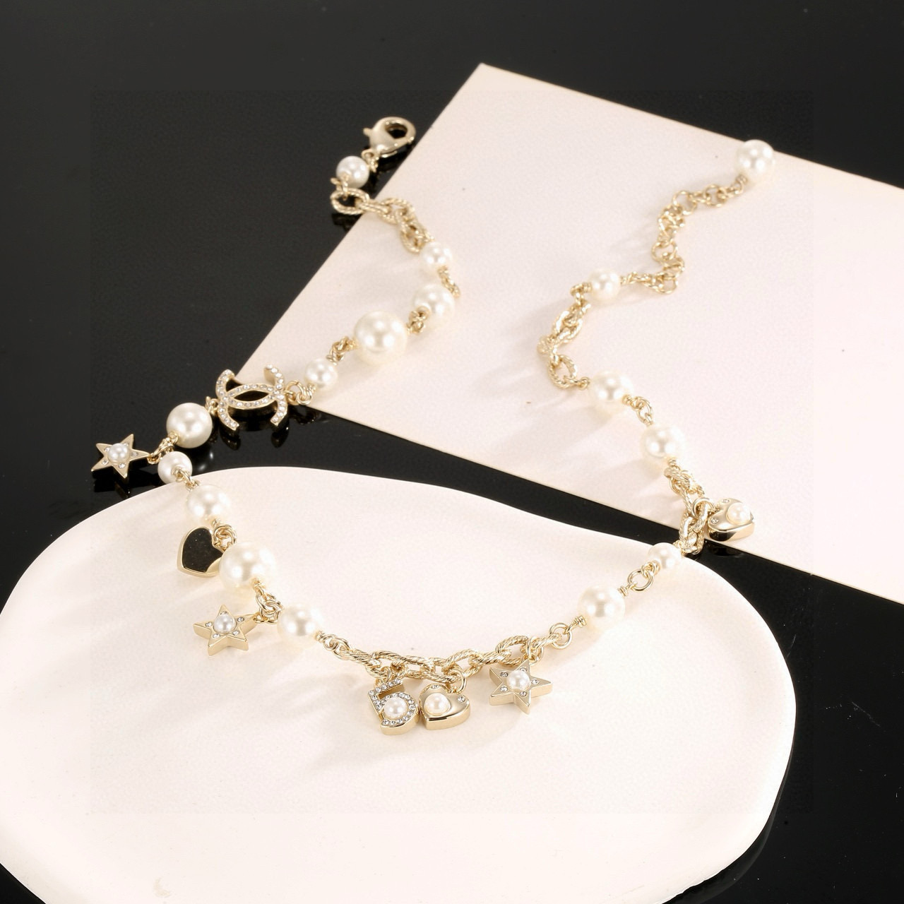 Chanel CC Charm Pearl Star Heart Necklace necklace Gold-tone metal cream white faux pearls clear crystal accents 42cm with 5cm extender