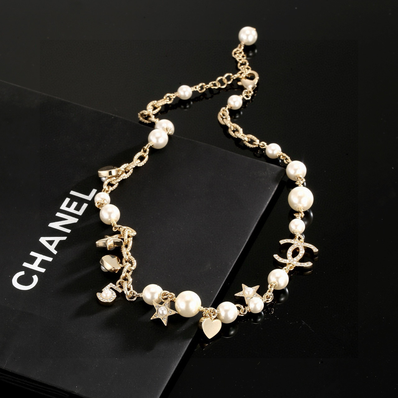Chanel CC Charm Pearl Star Heart Necklace necklace Gold-tone metal cream white faux pearls clear crystal accents 42cm with 5cm extender