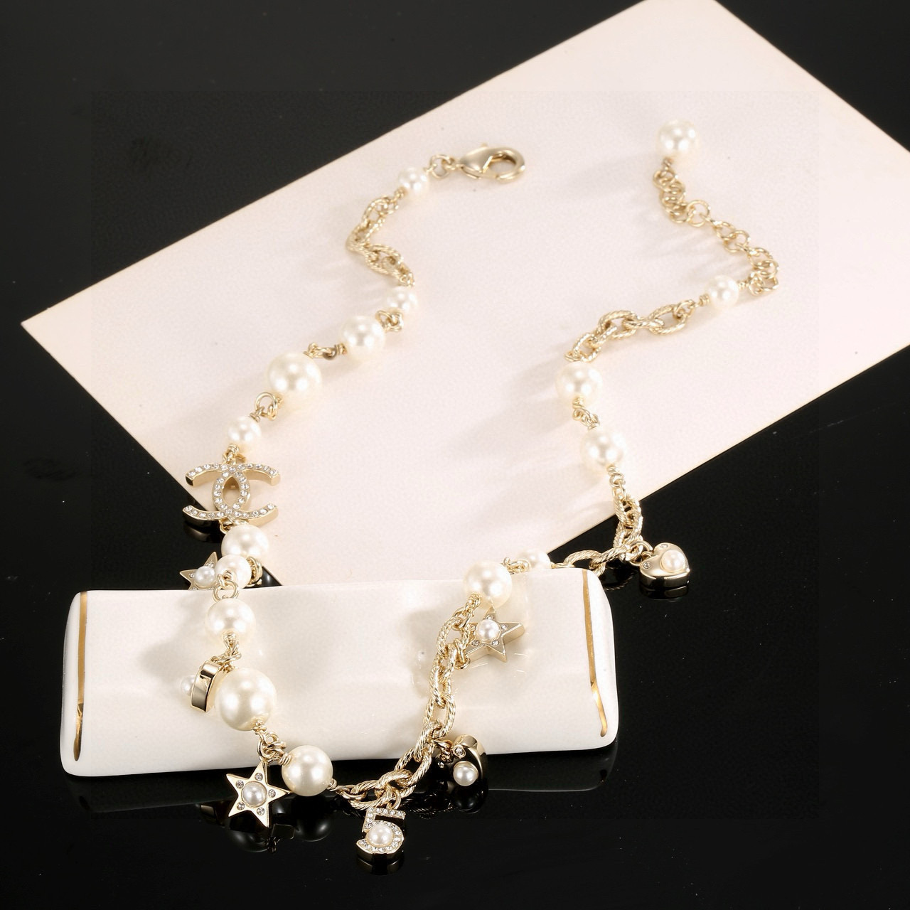 Chanel CC Charm Pearl Star Heart Necklace necklace Gold-tone metal cream white faux pearls clear crystal accents 42cm with 5cm extender