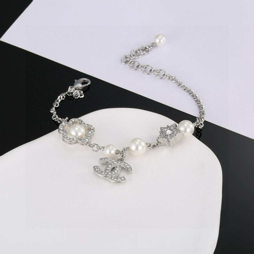 Chanel CC Logo Pearl Star Clover Charm Bracelet bracelet Silver-toned metal white faux pearls clear crystal rhinestones 18cm with 3cm extender