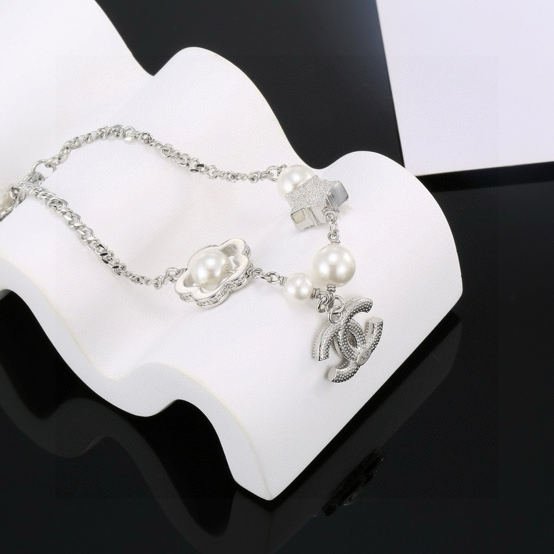 Chanel CC Logo Pearl Star Clover Charm Bracelet bracelet Silver-toned metal white faux pearls clear crystal rhinestones 18cm with 3cm extender