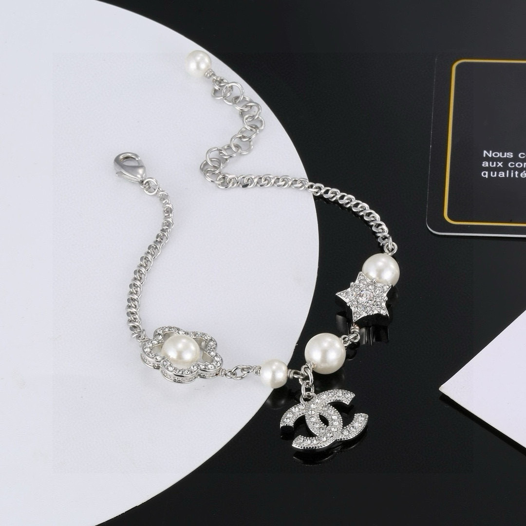 Chanel CC Logo Pearl Star Clover Charm Bracelet bracelet Silver-toned metal white faux pearls clear crystal rhinestones 18cm with 3cm extender