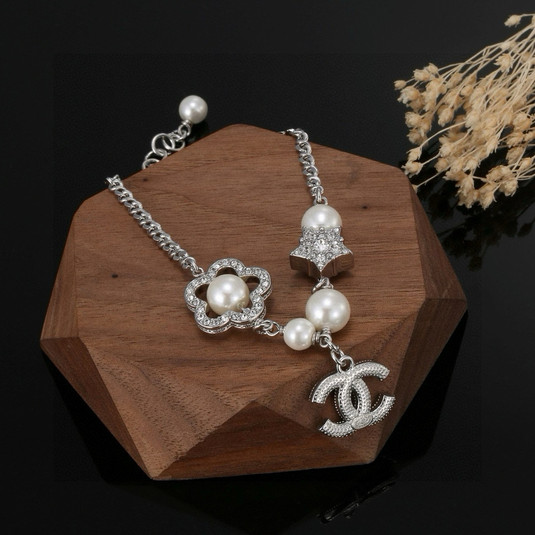 Chanel CC Logo Pearl Star Clover Charm Bracelet bracelet Silver-toned metal white faux pearls clear crystal rhinestones 18cm with 3cm extender