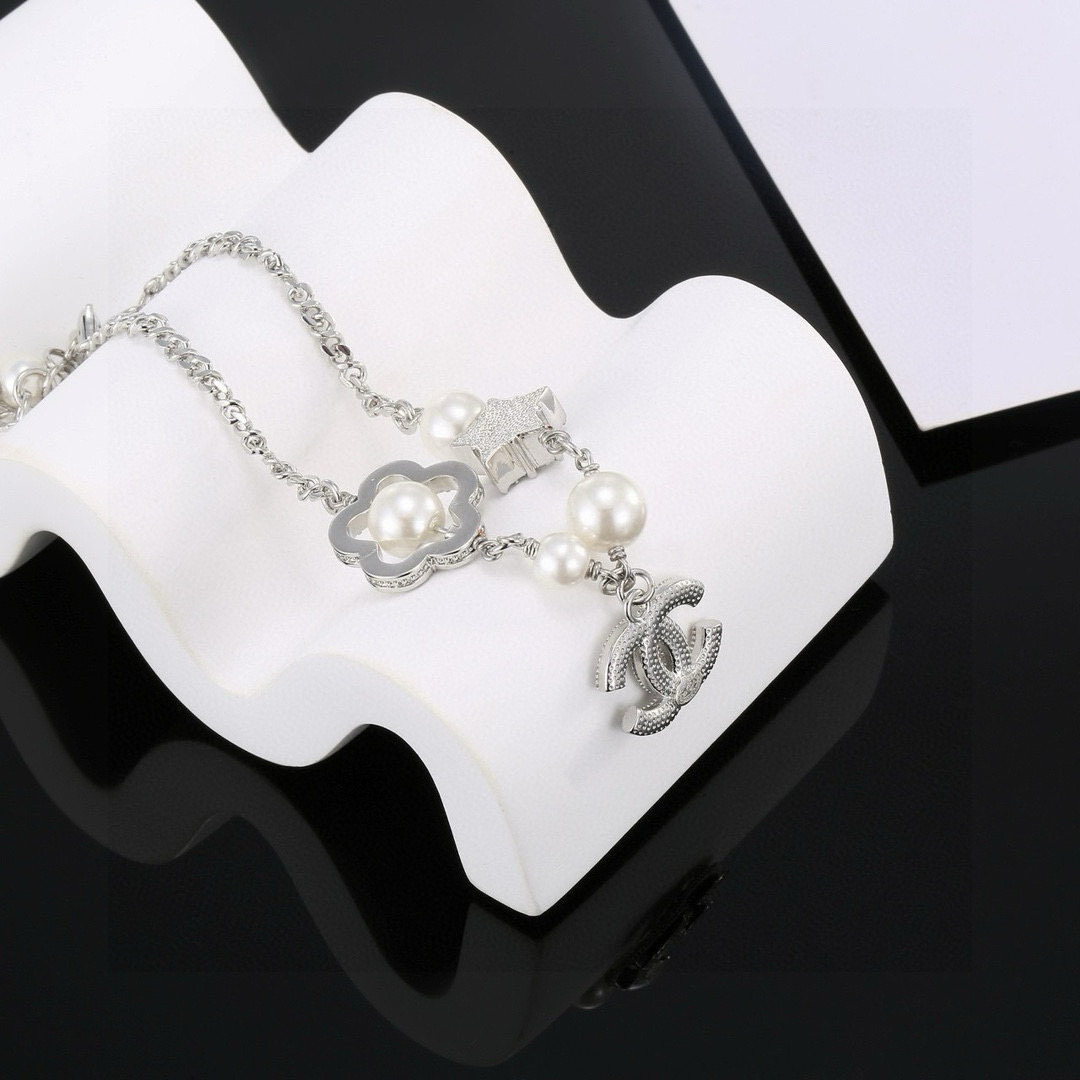 Chanel CC Logo Pearl Star Clover Charm Bracelet bracelet Silver-toned metal white faux pearls clear crystal rhinestones 18cm with 3cm extender