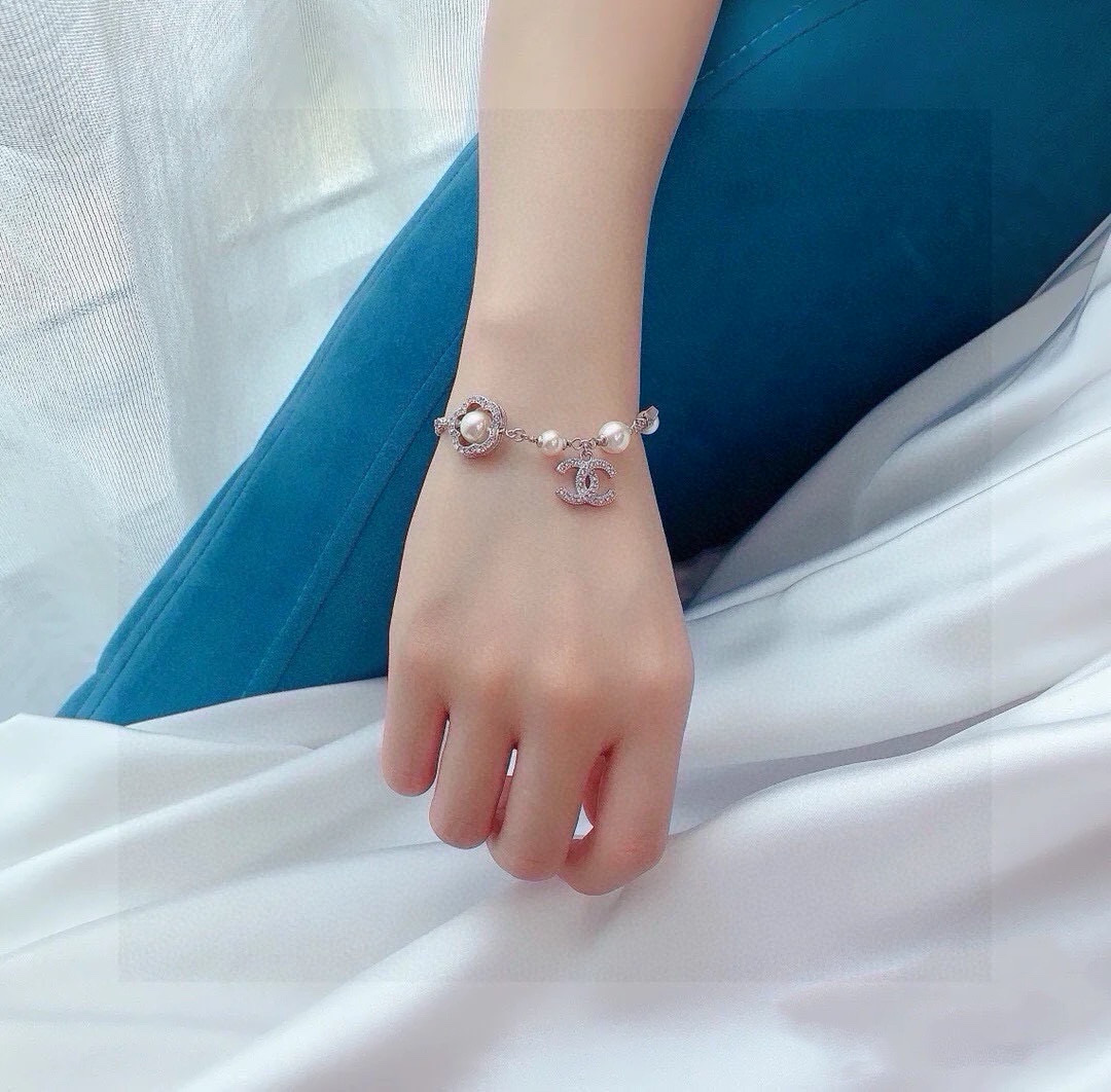 Chanel CC Logo Pearl Star Clover Charm Bracelet bracelet Silver-toned metal white faux pearls clear crystal rhinestones 18cm with 3cm extender