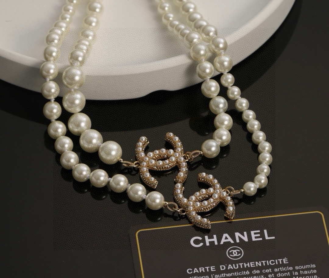 Chanel CC Logo Multi-Charm Pearl Long Necklace necklace Gold-tone metal cream white faux pearl clear crystal 80cm with 5cm extension chain