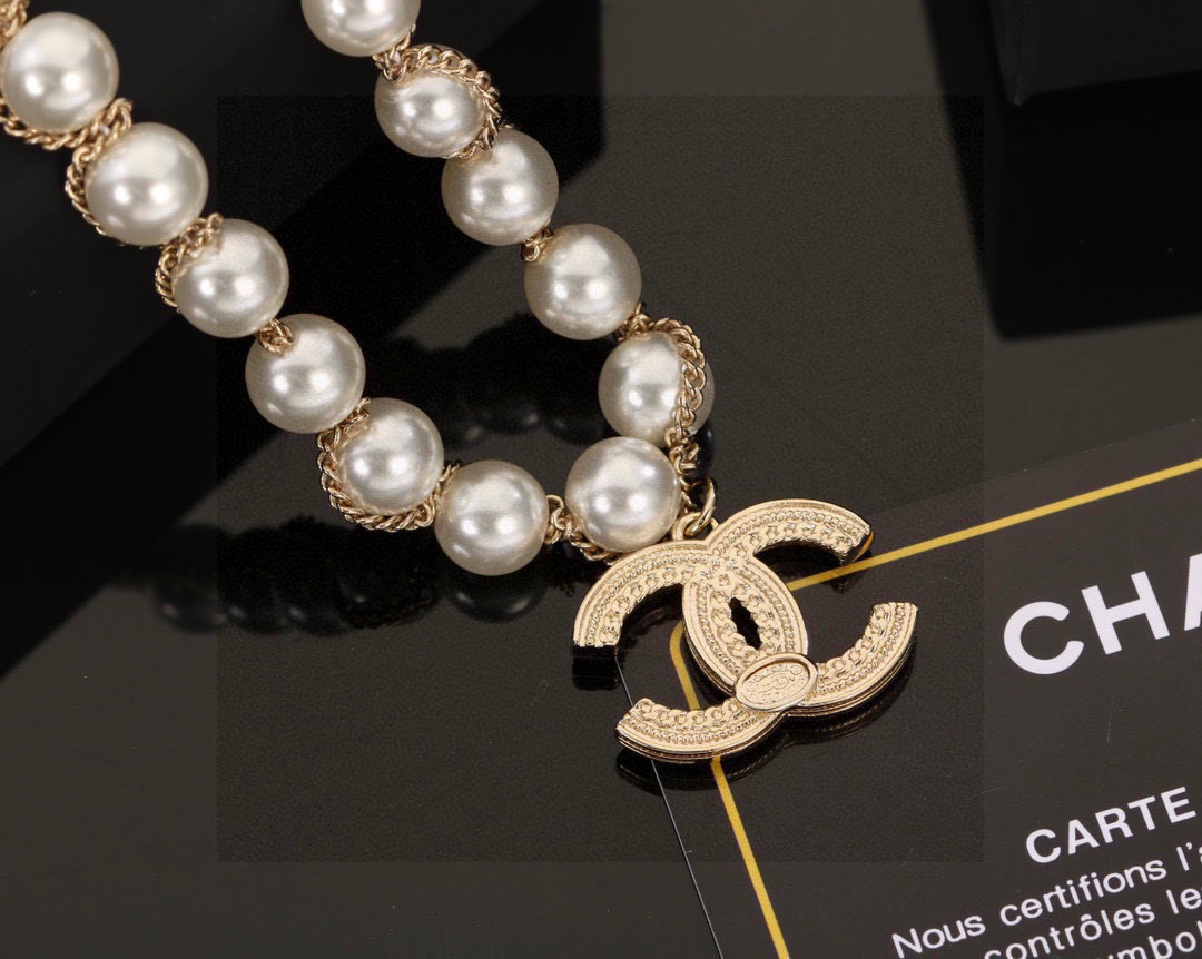 Chanel CC Logo Pearl Chain necklace gold-tone metal white faux pearl clear crystal 42cm