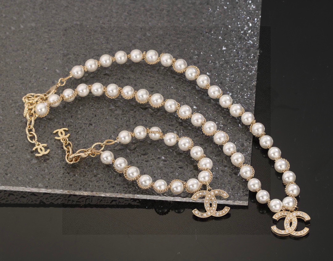 Chanel CC Logo Pearl Chain necklace gold-tone metal white faux pearl clear crystal 42cm