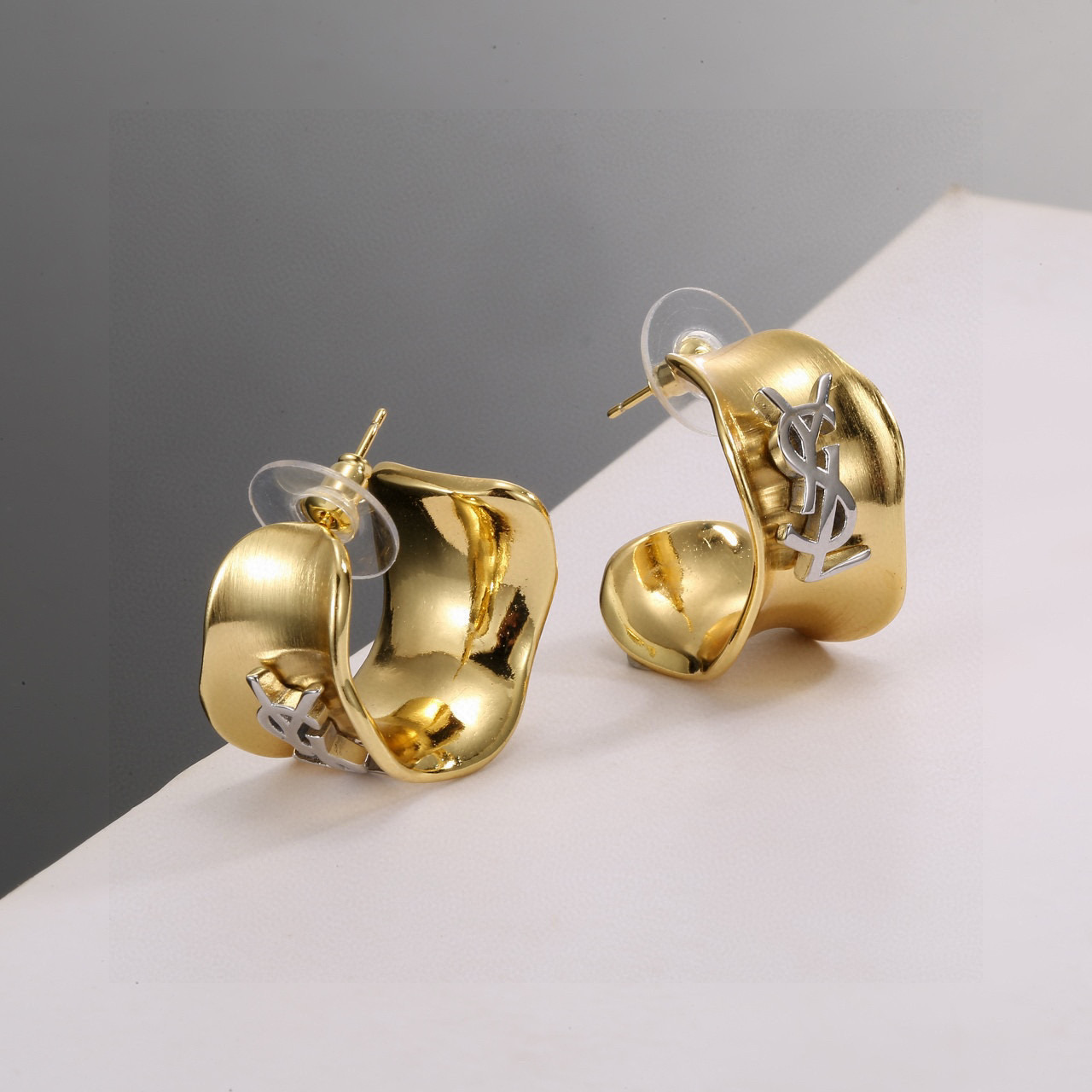 Saint Laurent Cassandre YSL Monogram Wavy Hoop earrings gold-tone metal with silver-tone YSL monogram 20mm hoop diameter