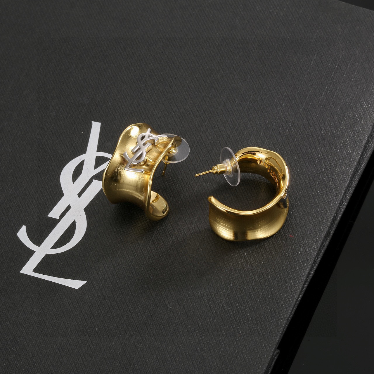 Saint Laurent Cassandre YSL Monogram Wavy Hoop earrings gold-tone metal with silver-tone YSL monogram 20mm hoop diameter
