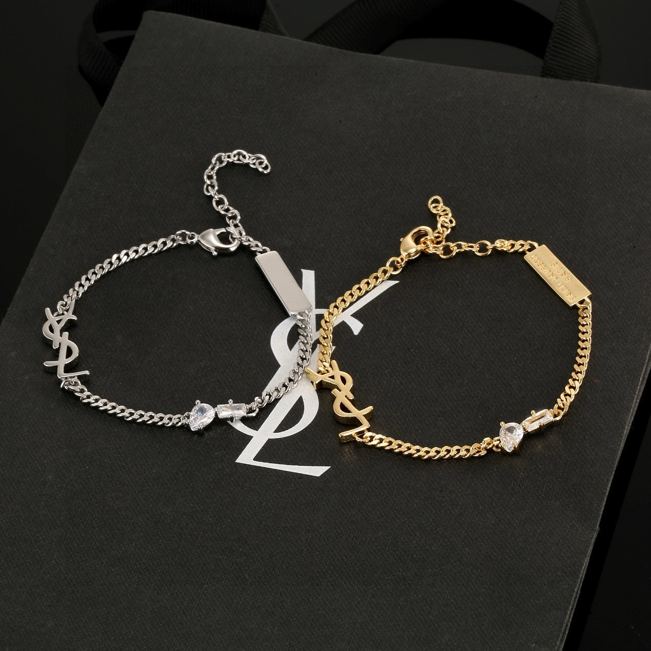 Saint Laurent YSL 1961 Logo Tag Chain Bracelet bracelet silver-tone metal with clear cubic zirconia stones 18cm with 5cm extension