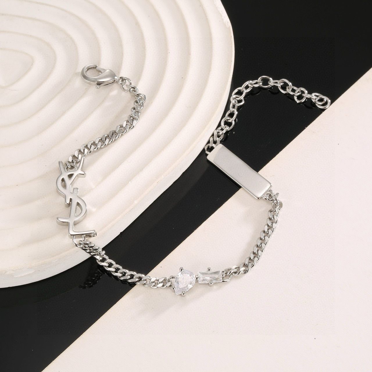 Saint Laurent YSL 1961 Logo Tag Chain Bracelet bracelet silver-tone metal with clear cubic zirconia stones 18cm with 5cm extension