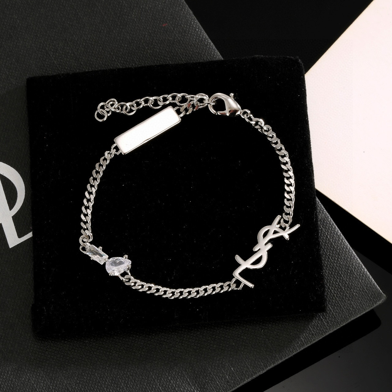 Saint Laurent YSL 1961 Logo Tag Chain Bracelet bracelet silver-tone metal with clear cubic zirconia stones 18cm with 5cm extension