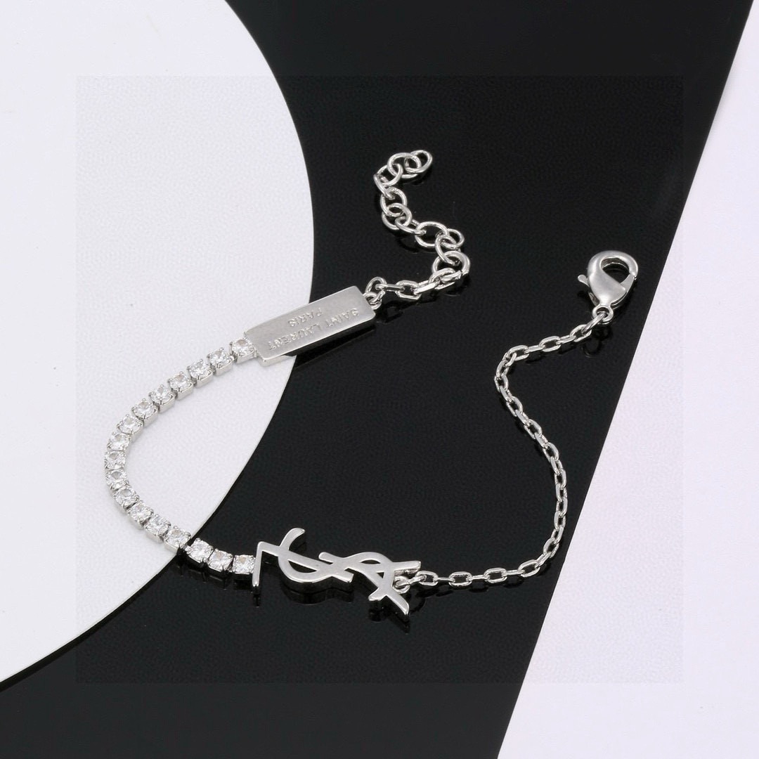 Saint Laurent Cassandre YSL Monogram Crystal Chain Bracelet bracelet Gold-tone metal with clear faceted crystals 16cm with 3cm extender
