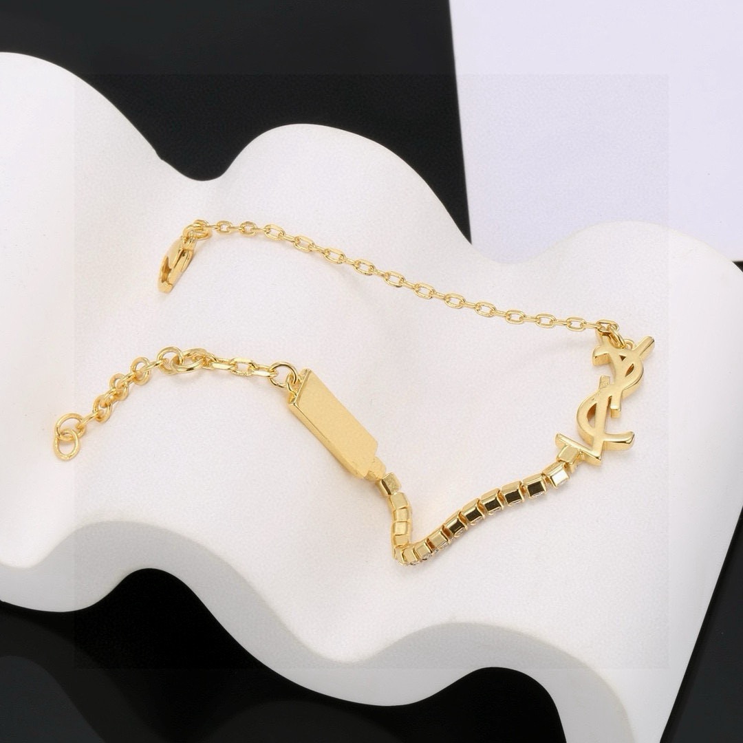 Saint Laurent Cassandre YSL Monogram Crystal Chain Bracelet bracelet Gold-tone metal with clear faceted crystals 16cm with 3cm extender
