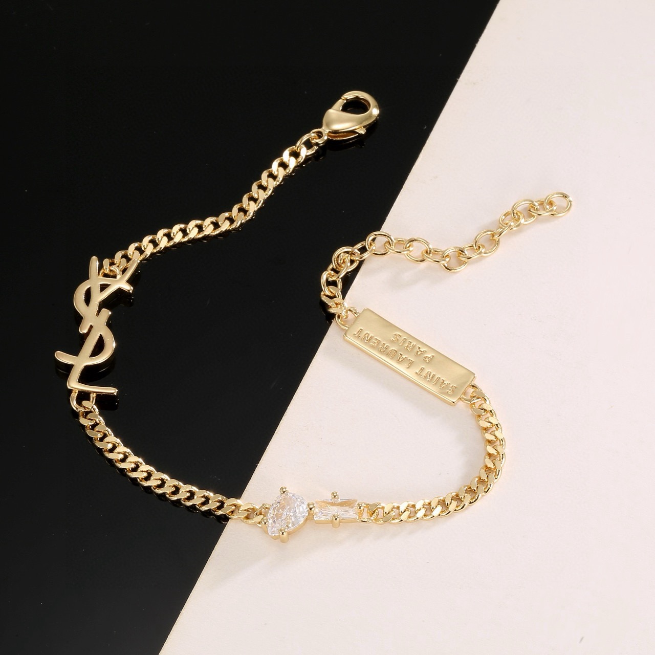 Saint Laurent YSL Monogram Logo Tag bracelet silver-toned metal with clear cubic zirconia stones 16cm with 5cm extension chain