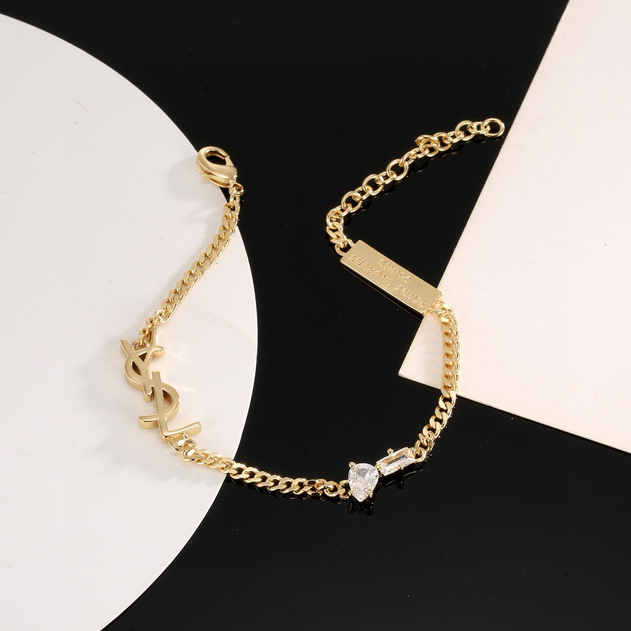 Saint Laurent YSL Monogram Logo Tag bracelet silver-toned metal with clear cubic zirconia stones 16cm with 5cm extension chain