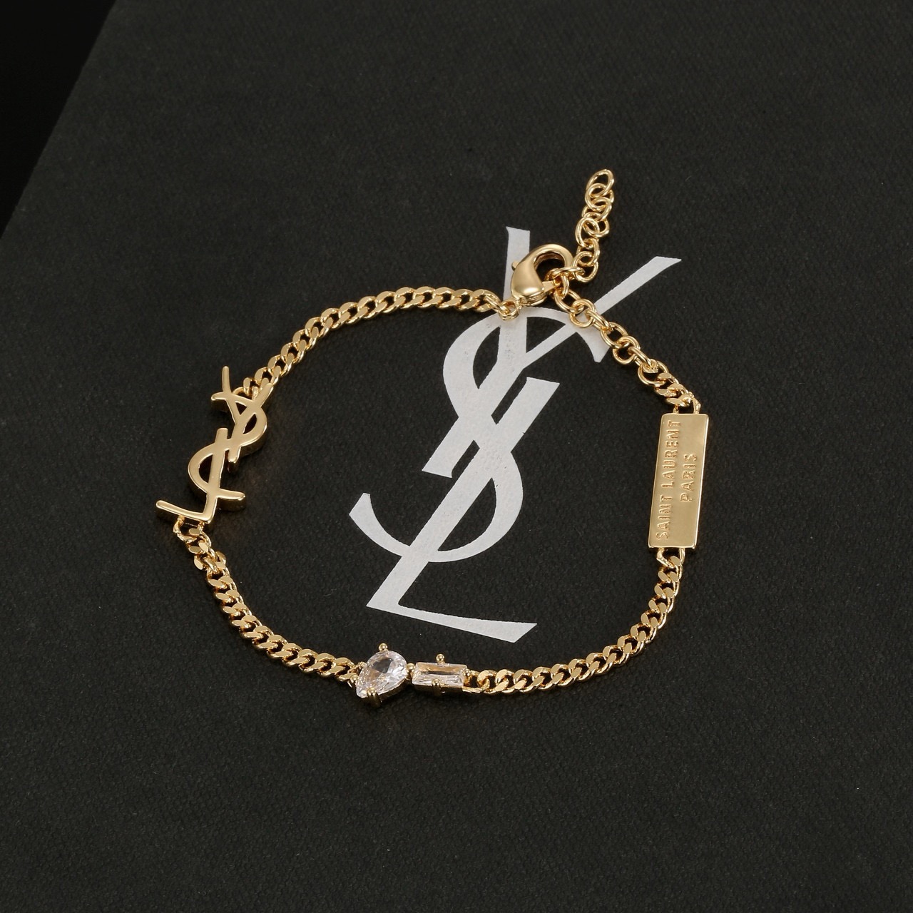 Saint Laurent YSL Monogram Logo Tag bracelet silver-toned metal with clear cubic zirconia stones 16cm with 5cm extension chain