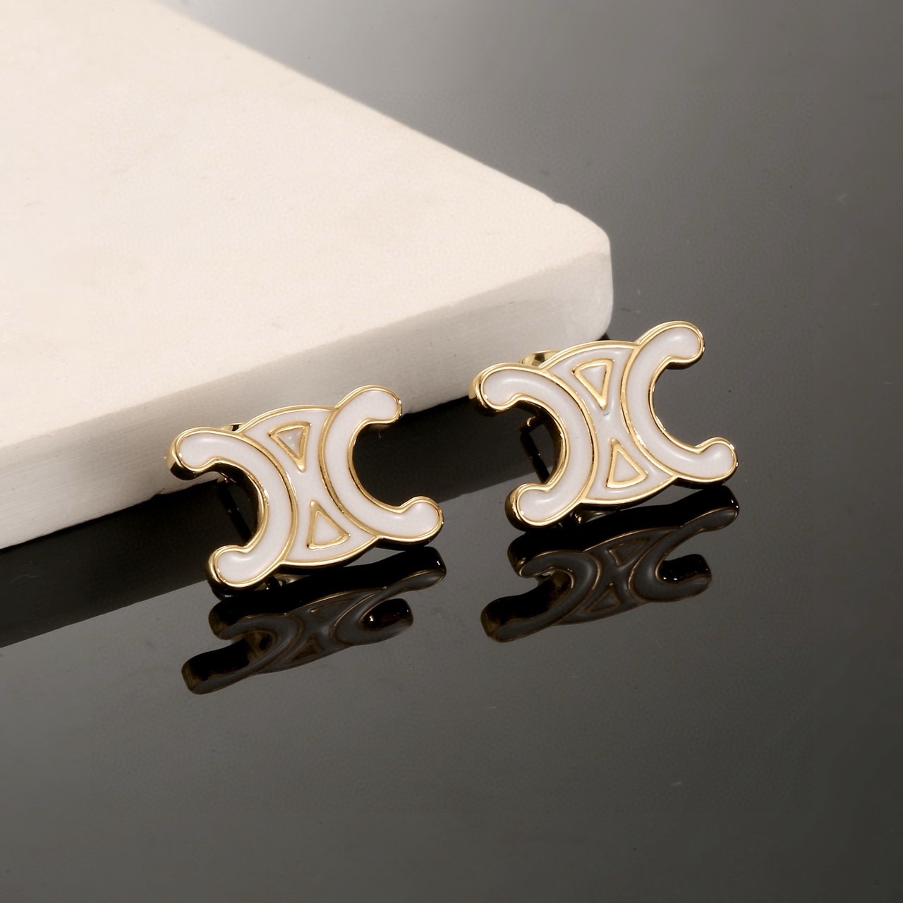 Celine Triomphe earrings gold-tone metal with white enamel 1 5cm stud diameter