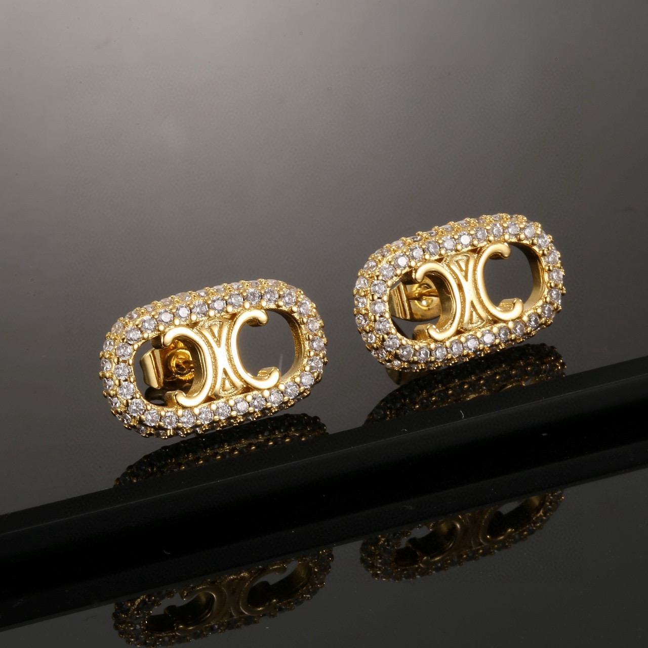 Celine Triomphe Crystal Oval Stud Earrings earrings gold-tone metal with clear crystal accents 1 5cm length