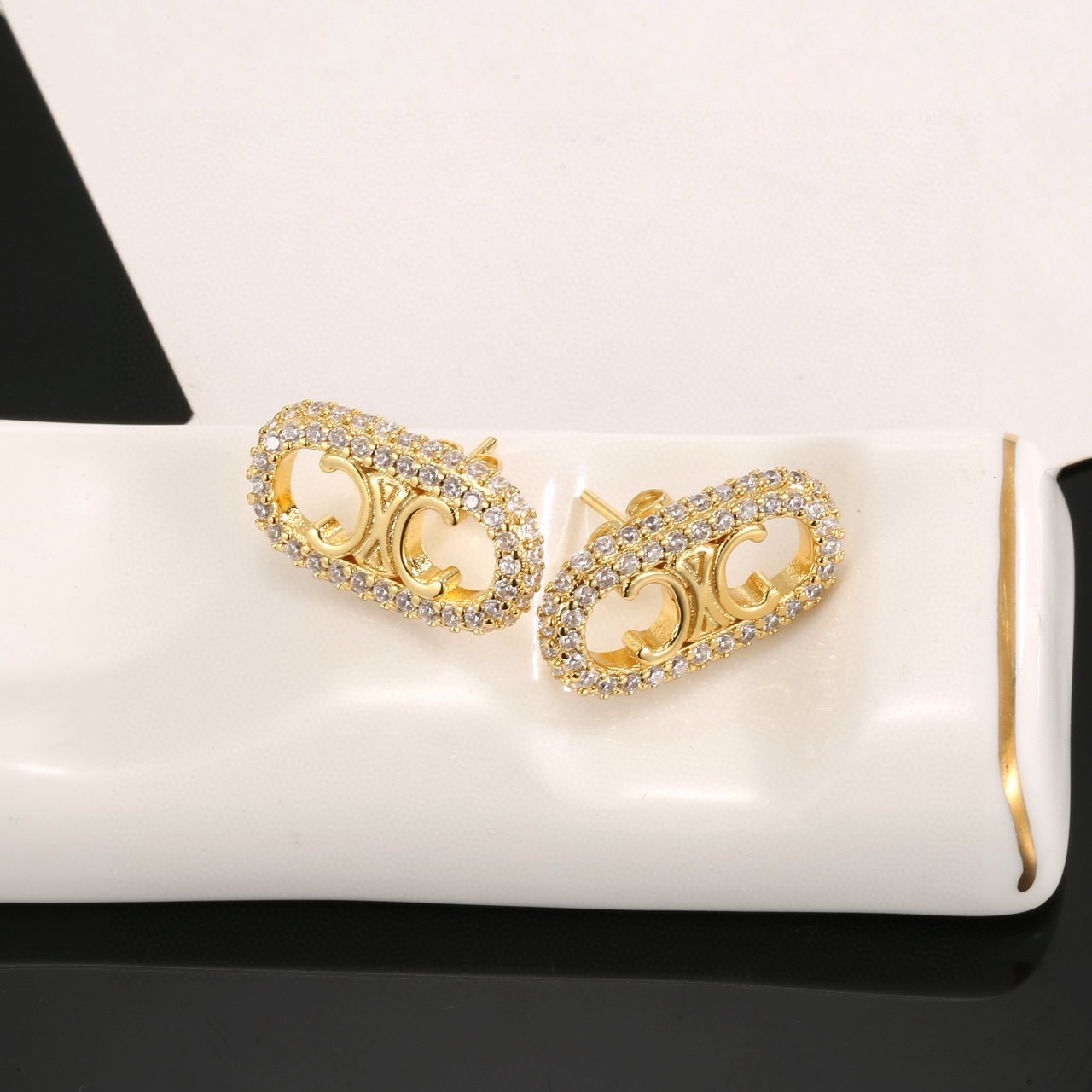 Celine Triomphe Crystal Oval Stud Earrings earrings gold-tone metal with clear crystal accents 1 5cm length