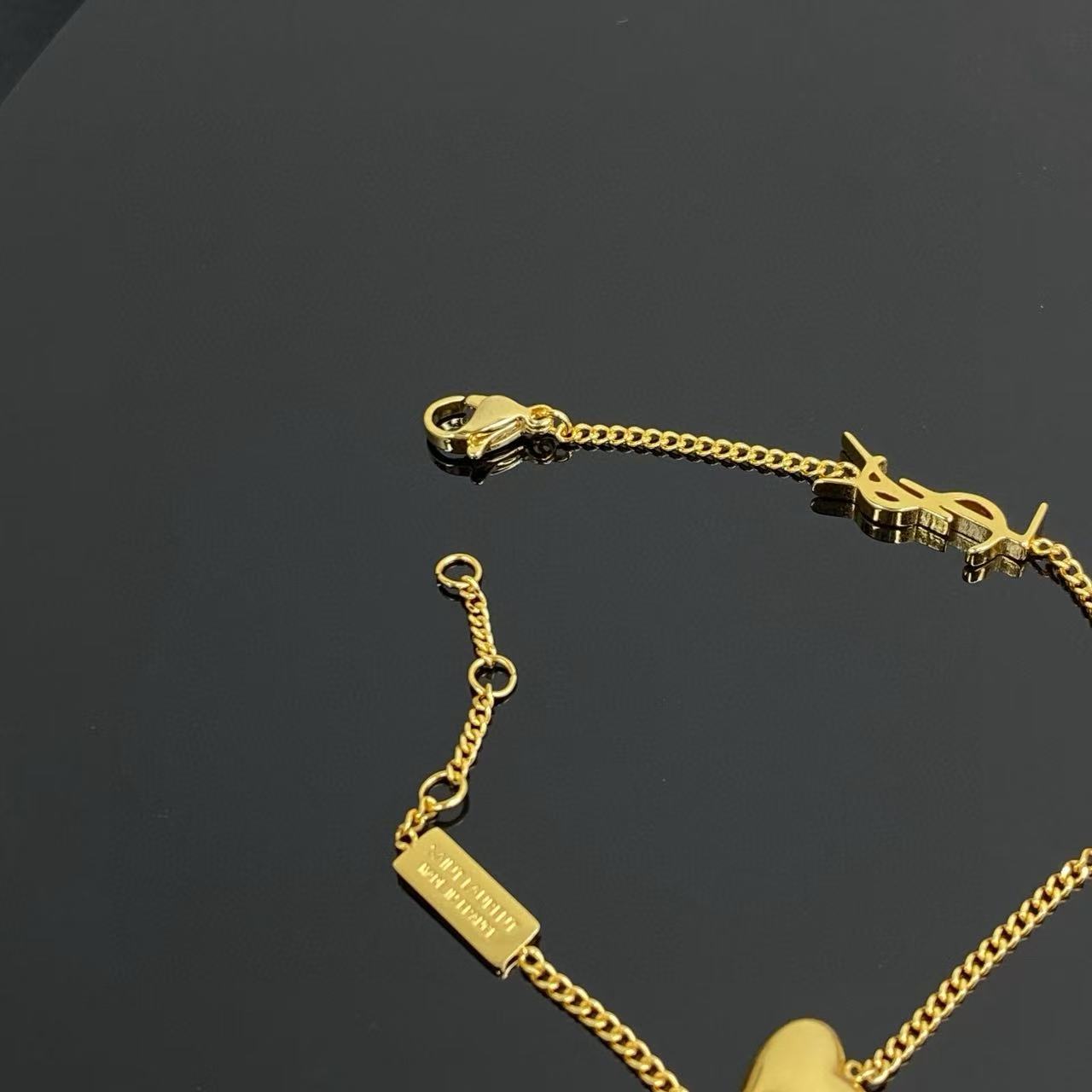 Saint Laurent Cassandre Heart Crystal Charm bracelet gold-tone metal with clear faceted crystal 19cm with 2cm extender