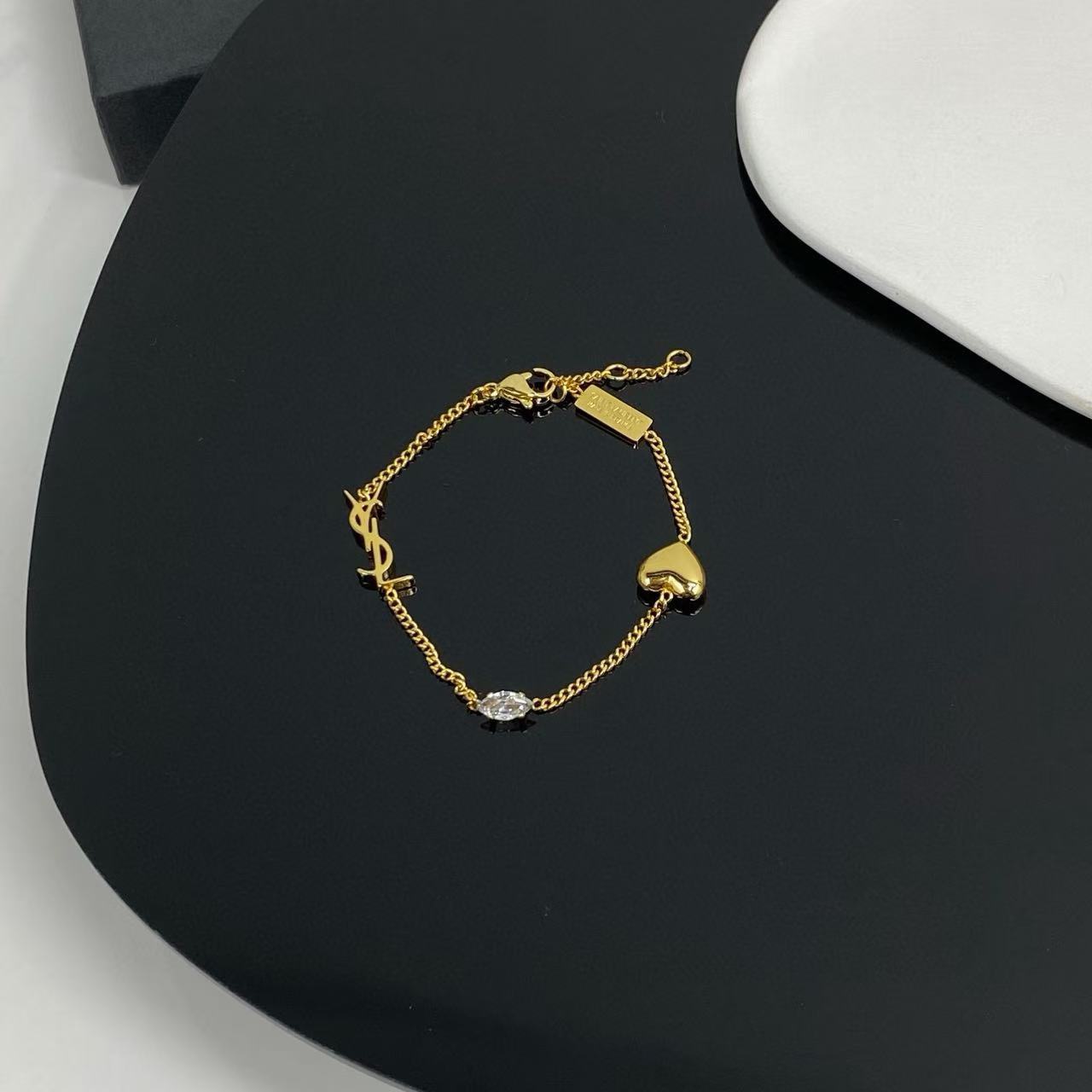 Saint Laurent YSL 1961 Heart Crystal Charm Bracelet bracelet gold-tone metal with clear faceted crystal 18cm with 3cm extender