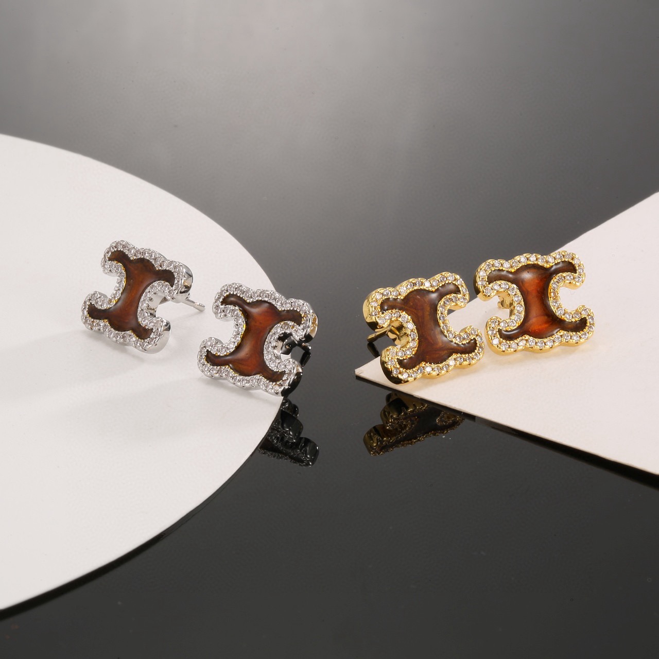 Celine Triomphe earrings gold-tone metal with brown enamel center and clear crystal accents 1 2cm stud diameter