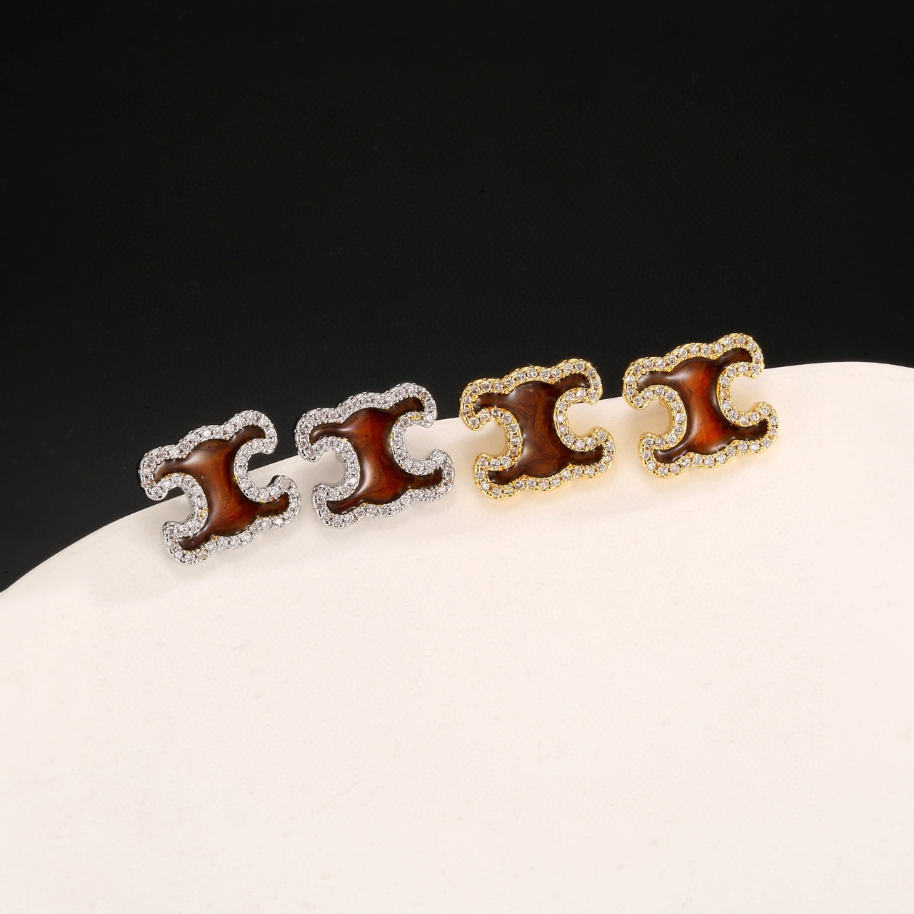 Celine Triomphe earrings gold-tone metal with brown enamel center and clear crystal accents 1 2cm stud diameter