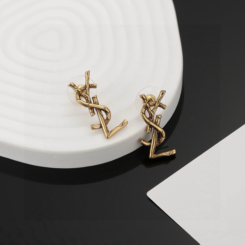 Saint Laurent Cassandre Twisted Monogram earrings antique gold tone metal no gemstones 2 2cm length