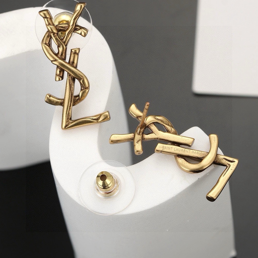 Saint Laurent Cassandre Twisted Monogram earrings antique gold tone metal no gemstones 2 2cm length