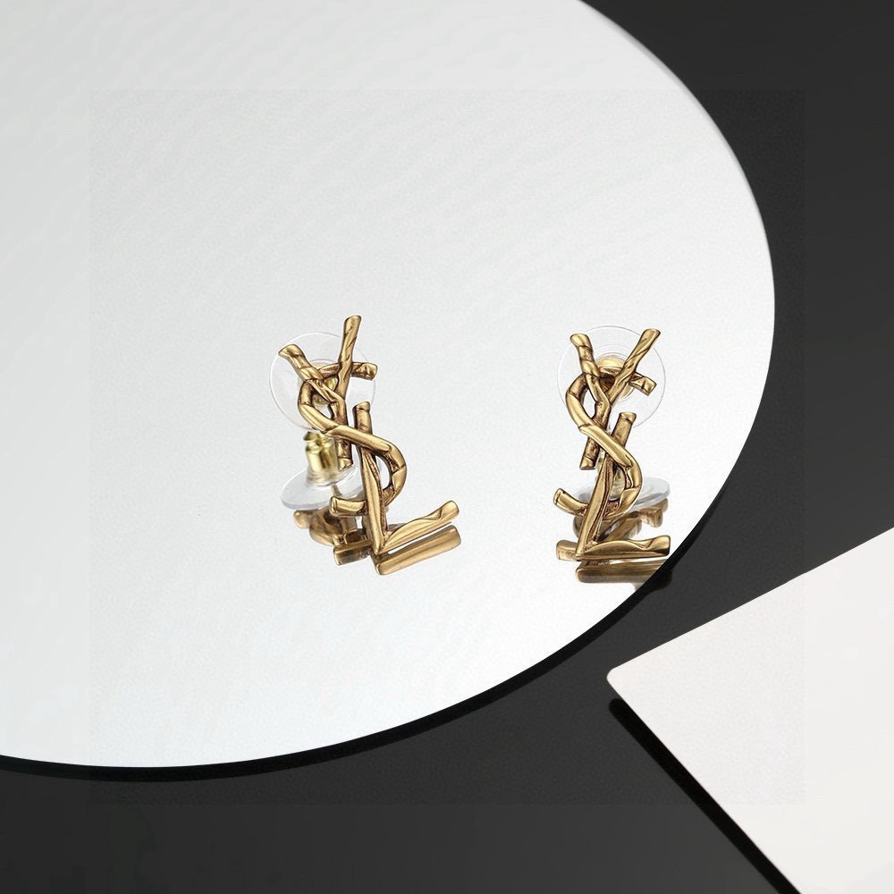 Saint Laurent Cassandre Twisted Monogram earrings antique gold tone metal no gemstones 2 2cm length
