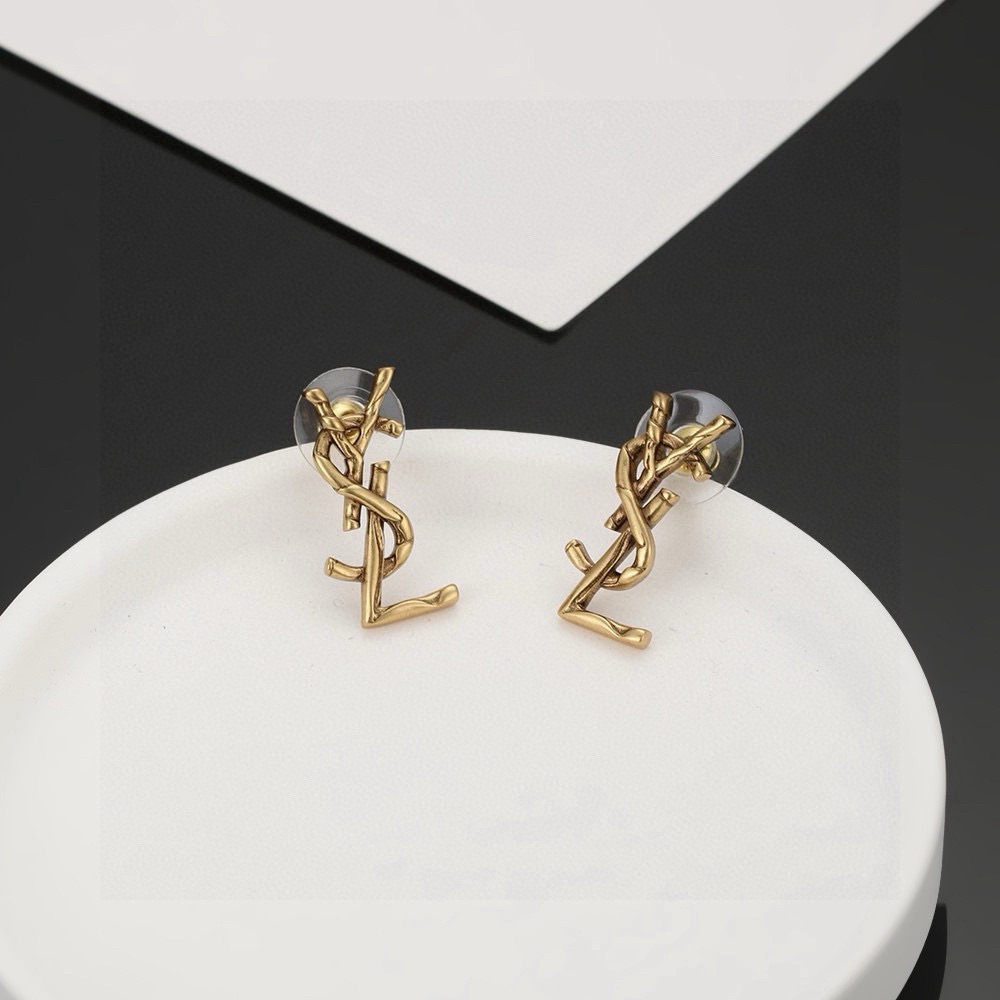 Saint Laurent Cassandre Twisted Monogram earrings antique gold tone metal no gemstones 2 2cm length