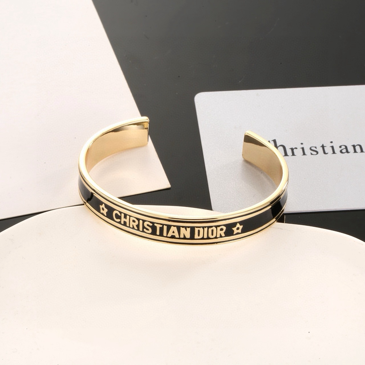 Dior Christian Dior Star Logo Cuff bracelet gold-tone metal with black enamel 17cm inner circumference
