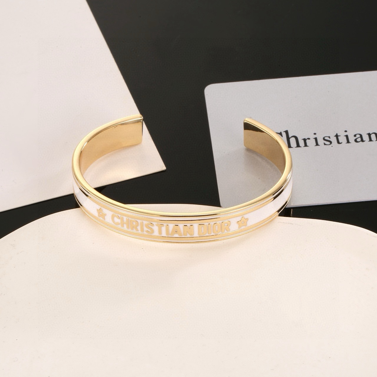Dior Christian Dior Code Star Cuff bracelet gold-tone metal with white enamel 17cm inner circumference