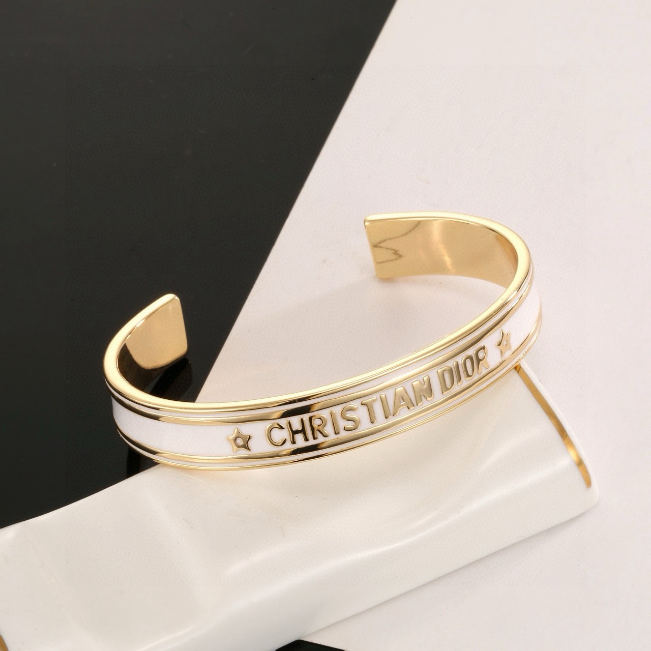 Dior Christian Dior Code Star Cuff bracelet gold-tone metal with white enamel 17cm inner circumference