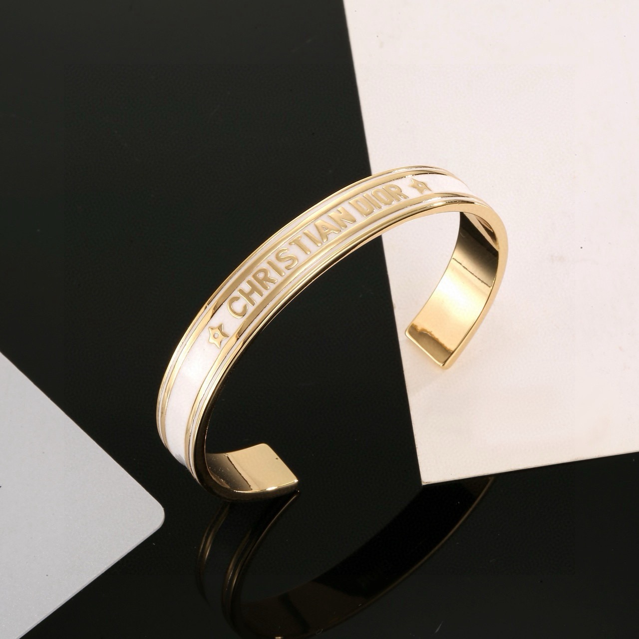 Dior Christian Dior Code Star Cuff bracelet gold-tone metal with white enamel 17cm inner circumference