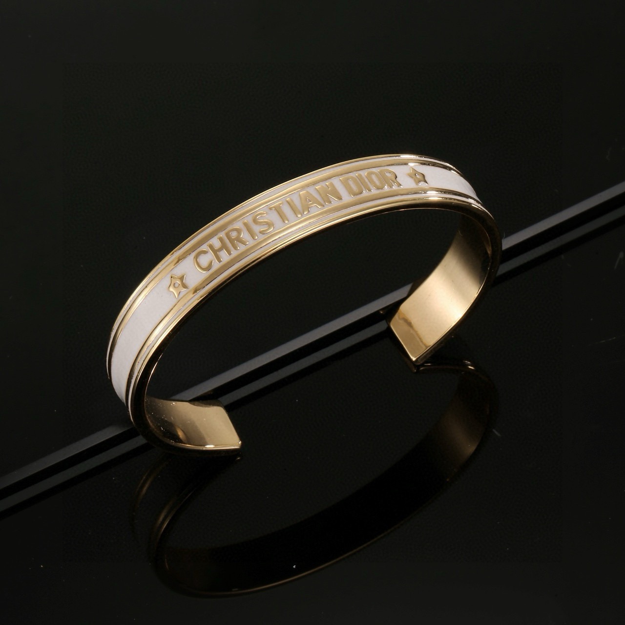 Dior Christian Dior Code Star Cuff bracelet gold-tone metal with white enamel 17cm inner circumference