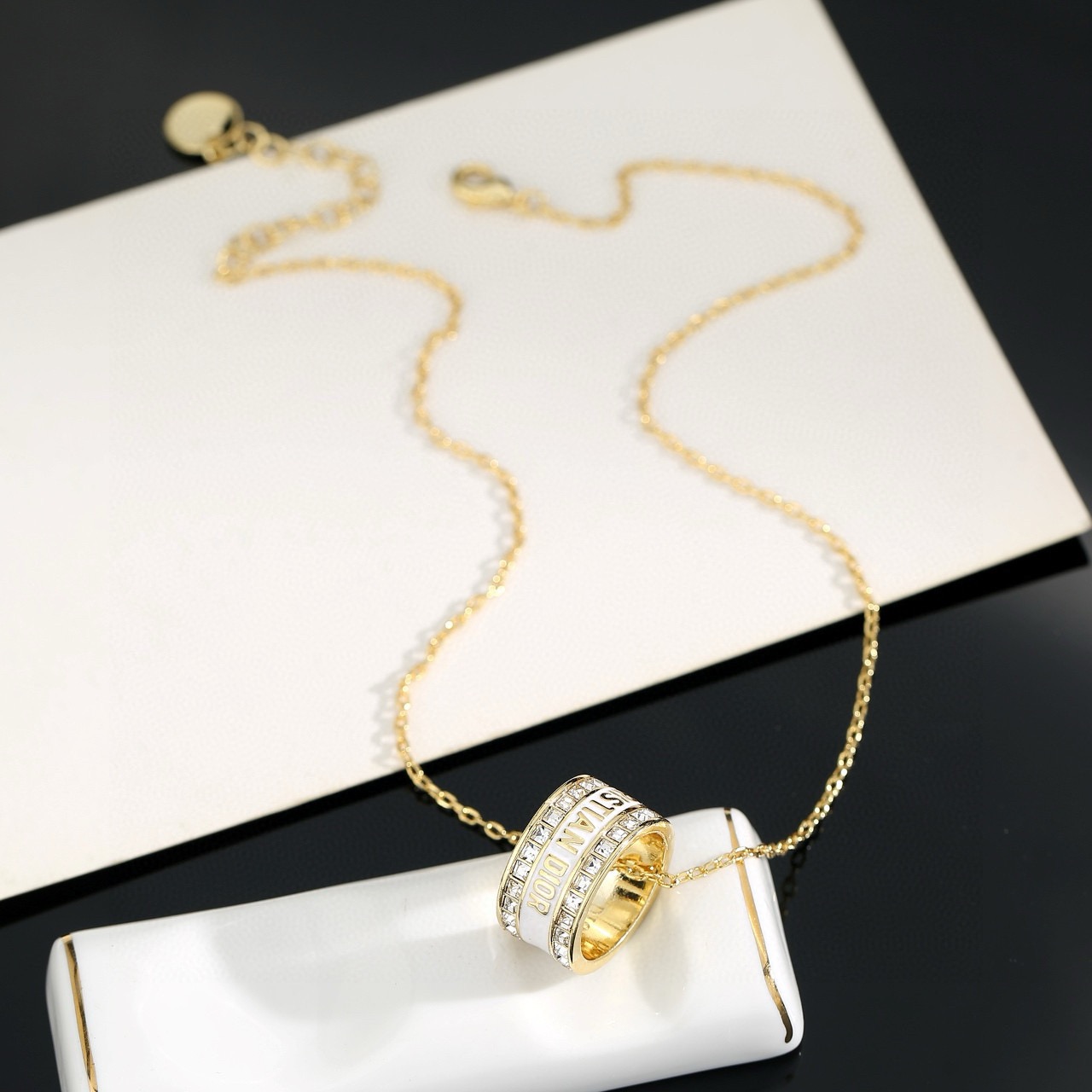 Dior JaDior Christian Dior Code Ring Pendant necklace gold-tone metal with clear crystal accents available with black enamel or white enamel lettering 42cm with 5cm extender