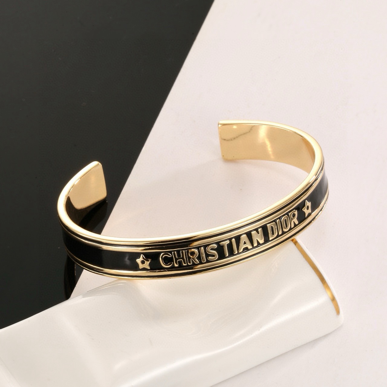 Dior Christian Dior Code Star Cuff bracelet gold-tone metal with black enamel 17cm inner circumference