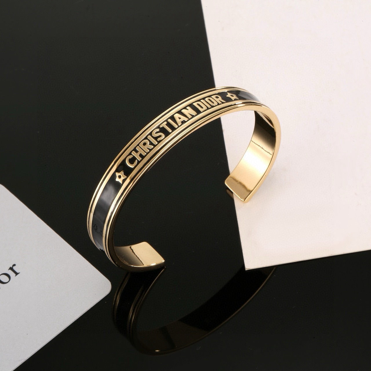 Dior Christian Dior Code Star Cuff bracelet gold-tone metal with black enamel 17cm inner circumference