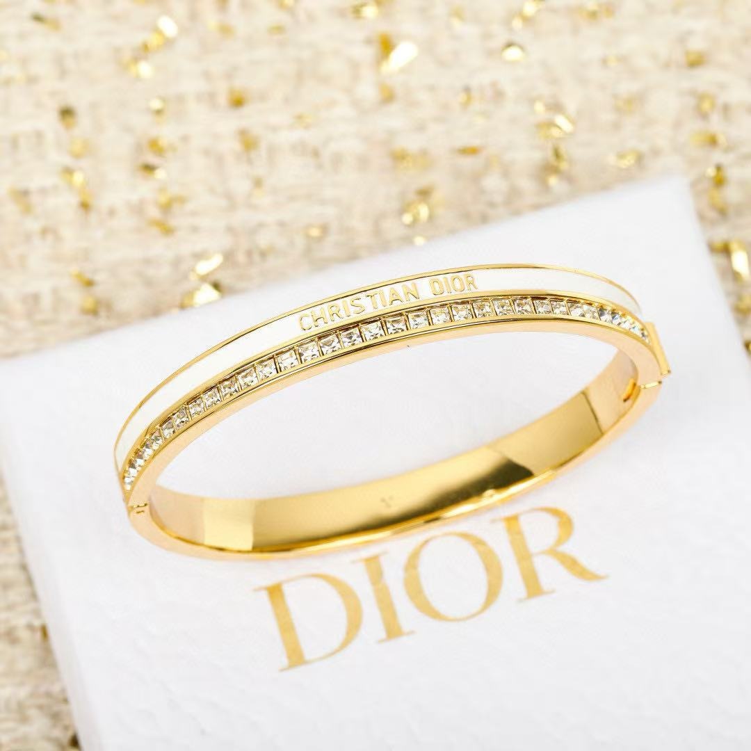 Dior CD New Christian Dior Night Code Bangle bracelet Gold-tone metal with clear crystal accents available in white enamel and black enamel variants M