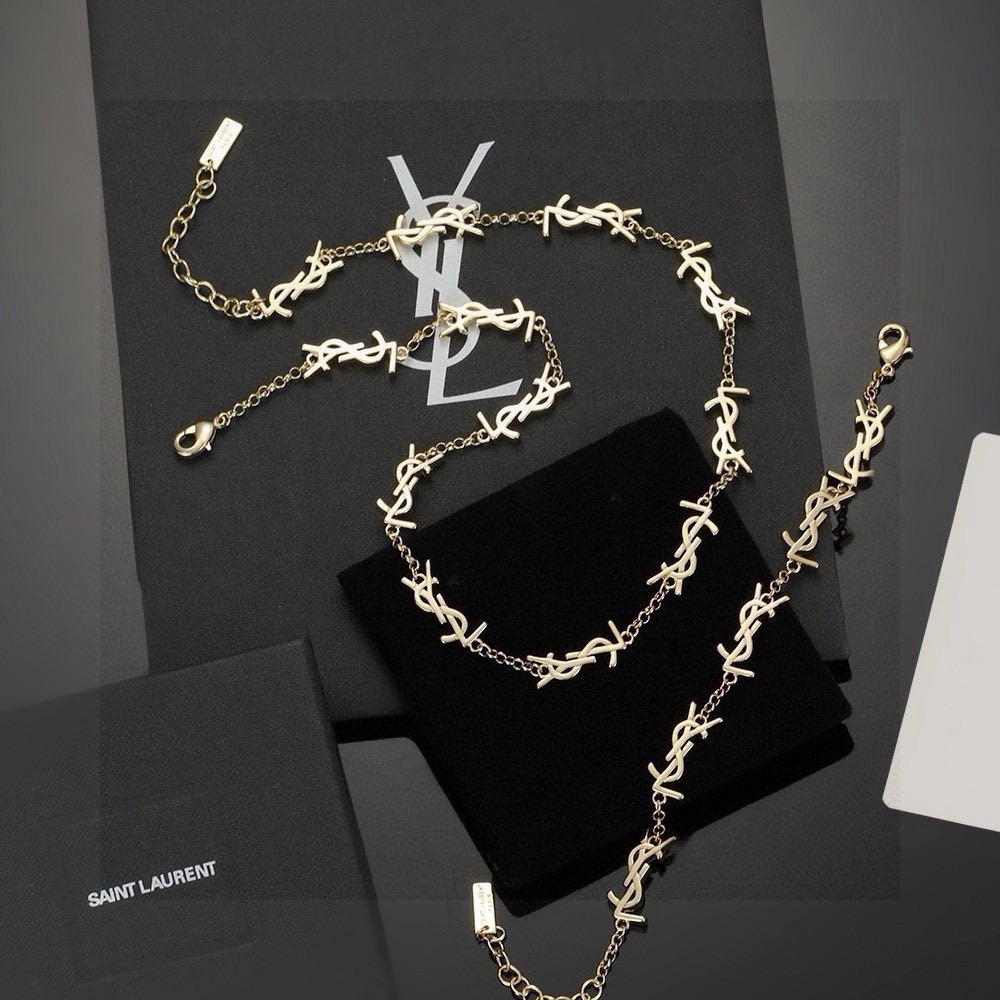 Saint Laurent Cassandre YSL Monogram bracelet gold-tone metal no gemstones 19cm with 5cm extender