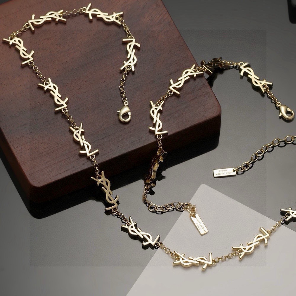 Saint Laurent Cassandre YSL Monogram bracelet gold-tone metal no gemstones 19cm with 5cm extender